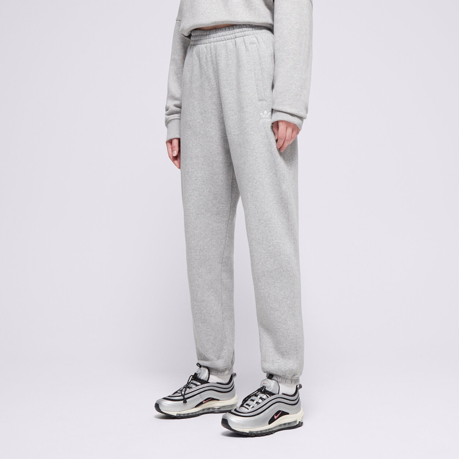 Femei pantaloni ADIDAS PANTALONI  ESS JOGGERS IY9638 Gri