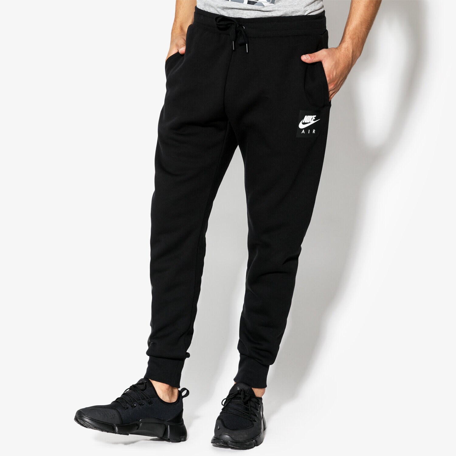 Bărbați pantaloni NIKE PANTALONI  M NSW PANT FLC NIKE AIR 928637-010 Negru