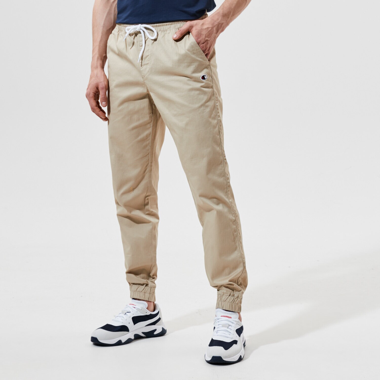 Bărbați pantaloni CHAMPION PANTALONI ELASTIC CUFF PANTS 214366MS025 Bej