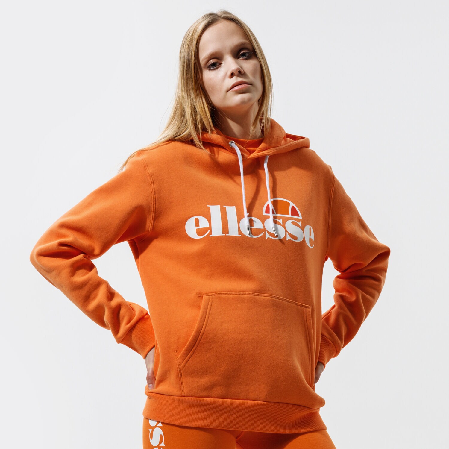 Femei bluză ELLESSE BLUZĂ CU GLUGĂ TORICES OH HOODY ORNG SGI03244704 Portocaliu