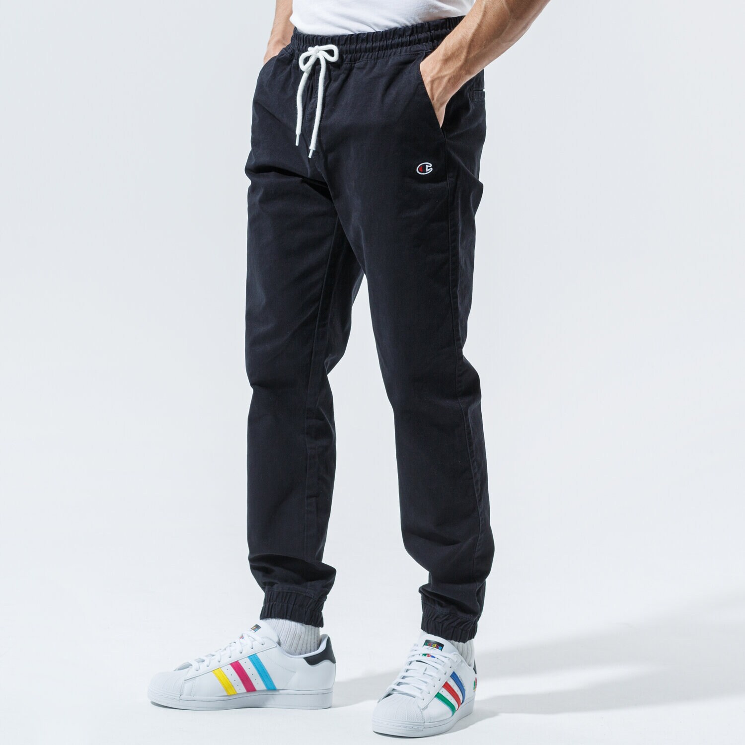 Bărbați pantaloni CHAMPION PANTALONI  ELASTIC CUFF PANTS 215193KK001 Negru