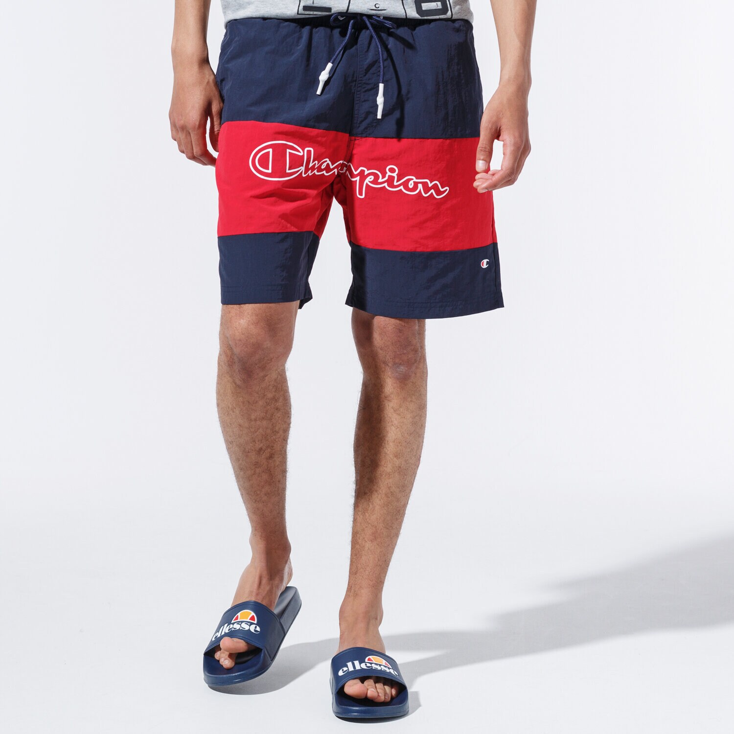Femei pantaloni scurți CHAMPION PANTALONI SCURȚI LOGO SWIM SHORTS 215499BS501 Bleumarin
