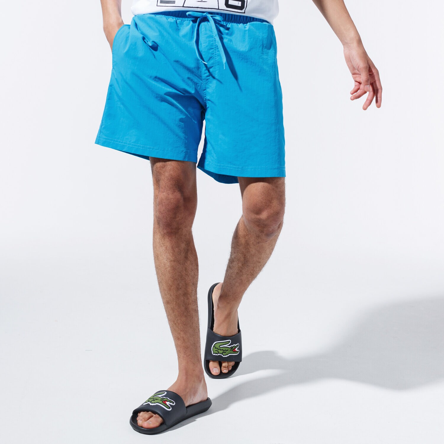 Femei pantaloni scurți CHAMPION PANTALONI SCURȚI BASIC SWIM SHORTS 215498BS030 Albastru