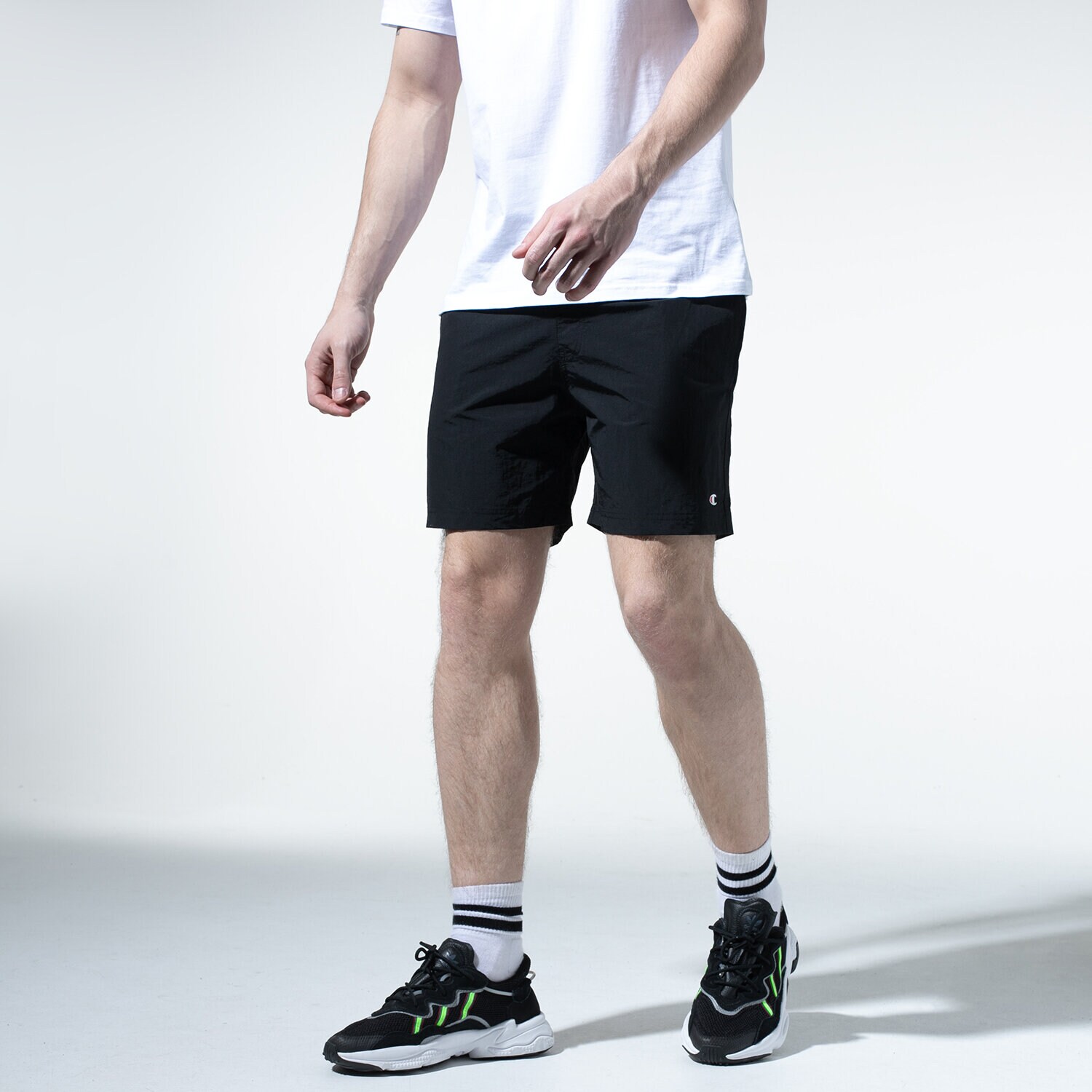 Femei pantaloni scurți CHAMPION PANTALONI SCURȚI BASIC SWIM SHORTS 215498KK001 Negru