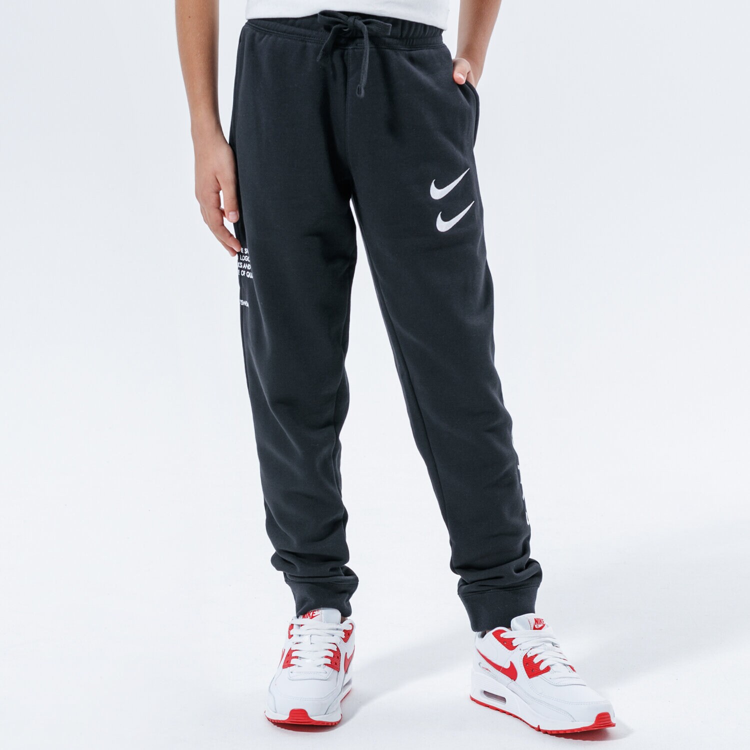 Pantaloni pentru copii NIKE PANTALONI SPORTSWEAR SWOOSH CU9195-010 Negru