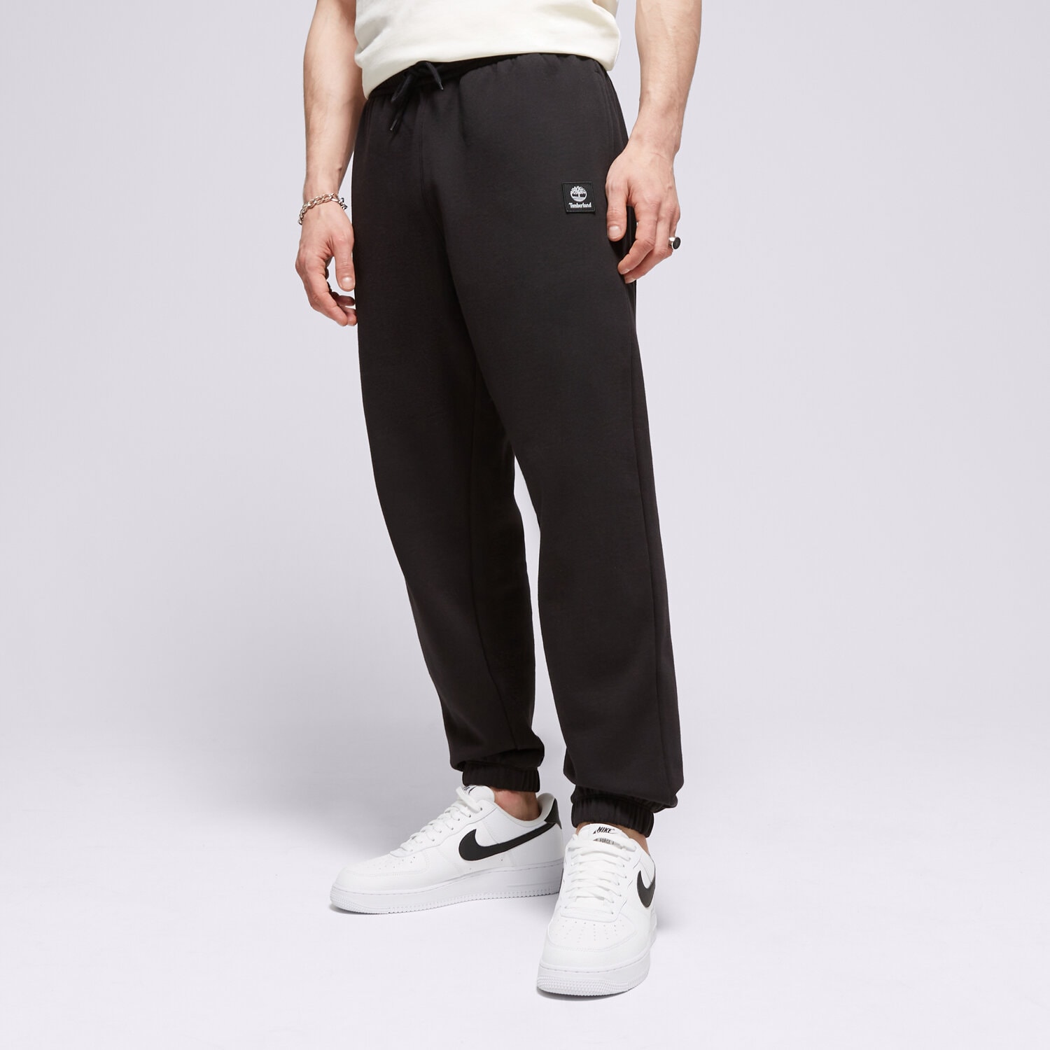 Bărbați pantaloni TIMBERLAND PANTALONI  NEW WOVEN BADGE SWEATPANT TB0A5UVY0011 Negru