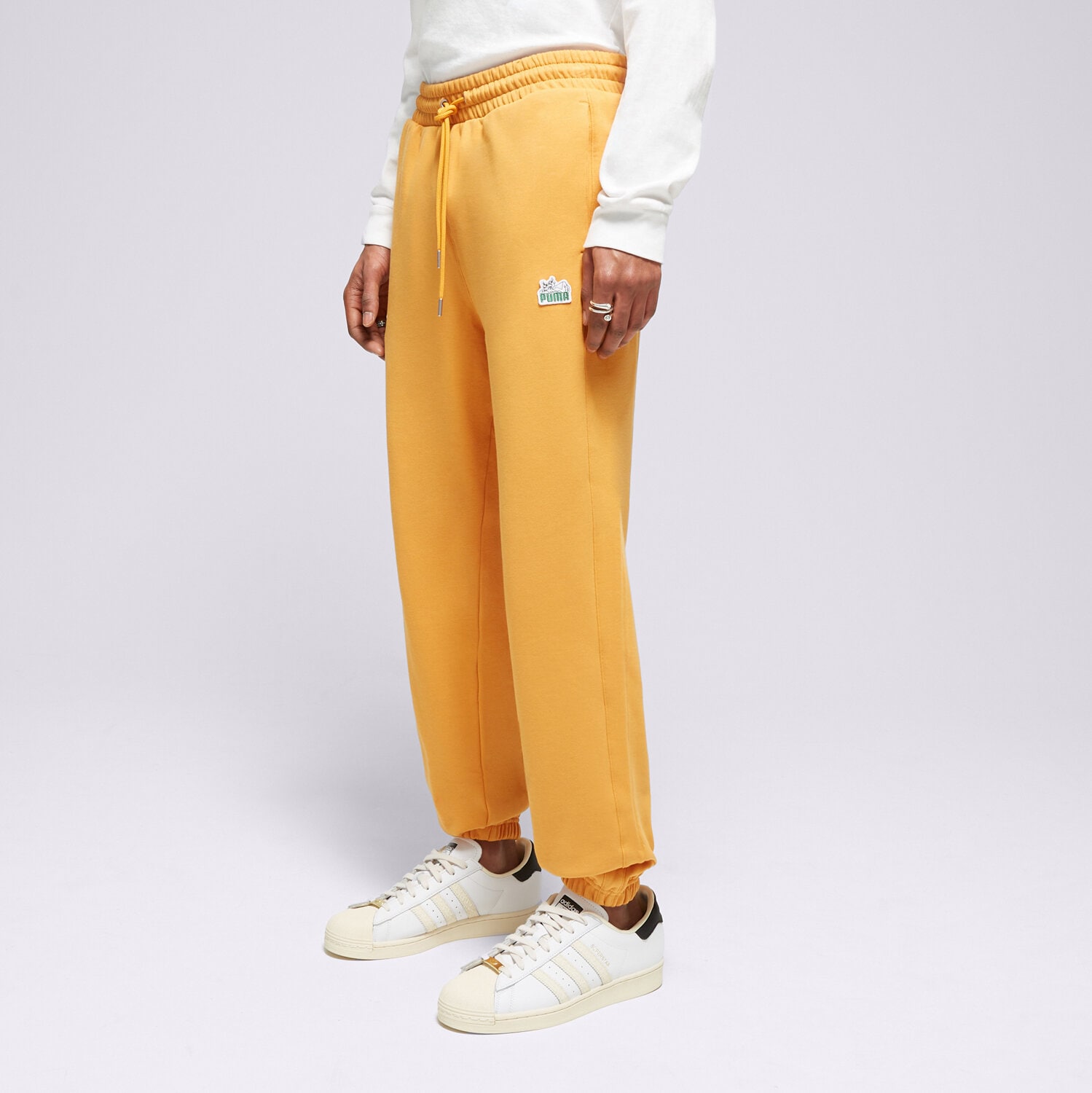 Bărbați pantaloni PUMA PANTALONI  T7 FOR THE FANBASE SUPER 62503991 Portocaliu