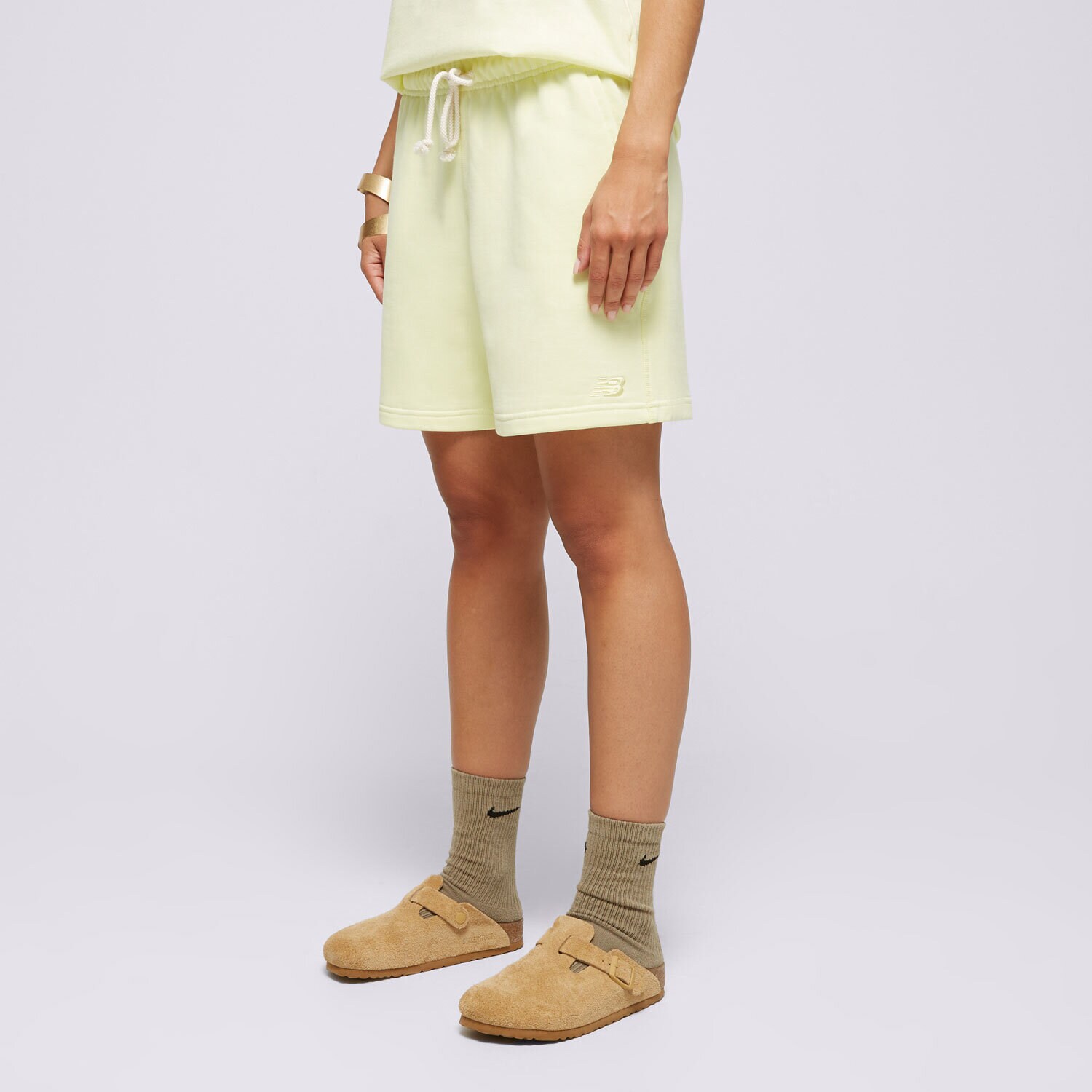Femei pantaloni scurți NEW BALANCE PANTALONI SCURȚI   ATHLETICS FRENCH TERRY WS41508LLT Galben