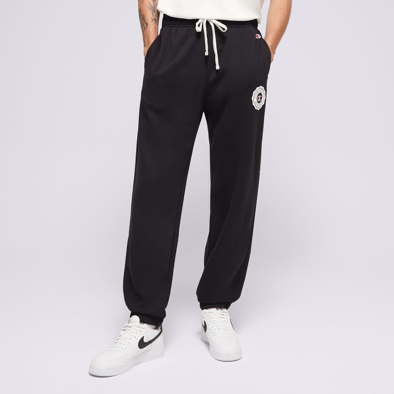 Bărbați pantaloni CHAMPION PANTALONI  ELASTIC CUFF 219849KK001 Negru