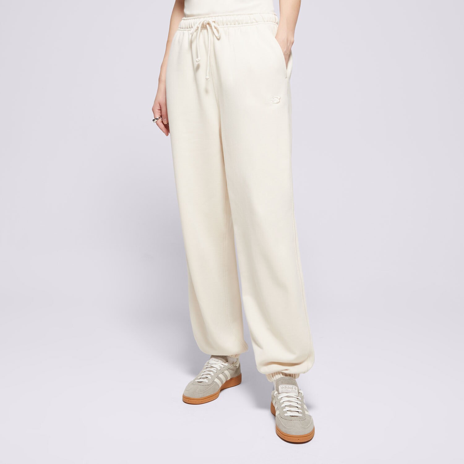 Femei pantaloni NEW BALANCE PANTALONI  ATHLETICS   FRENCH TERRY JOGGER WP41513LIN Bej