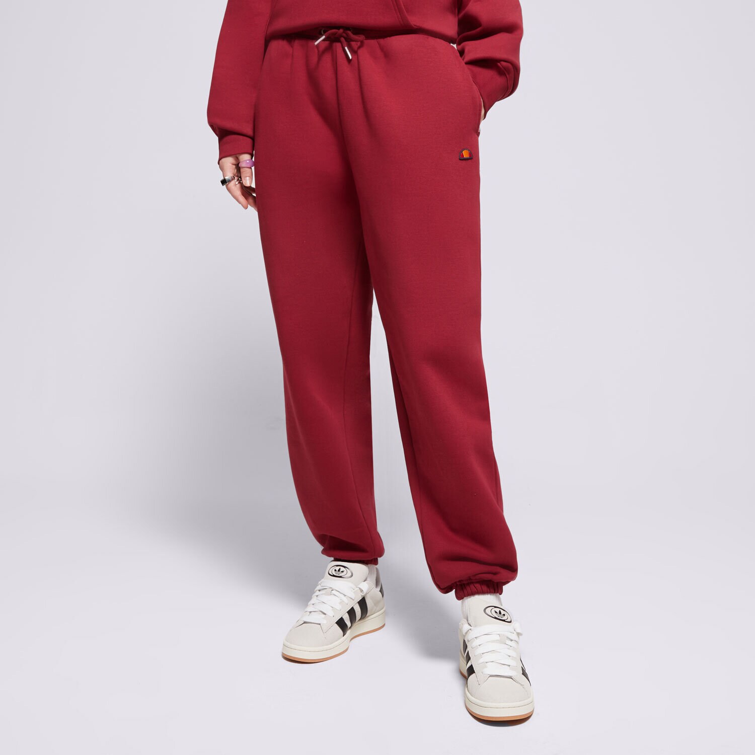 Femei pantaloni ELLESSE PANTALONI  MUGIA JOG PANT BRGND SMG22040800 Bordo