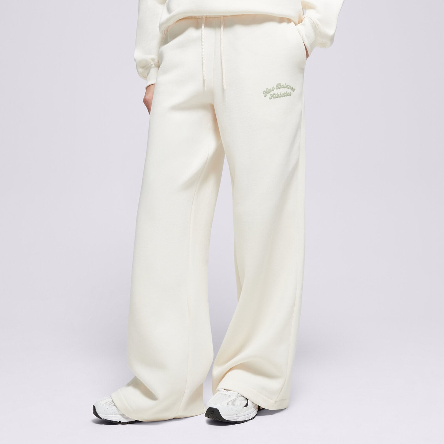 Femei pantaloni NEW BALANCE PANTALONI  LINEAR HERITAGE FLEECE WIDE LEG PANT WP53902PEF Bej
