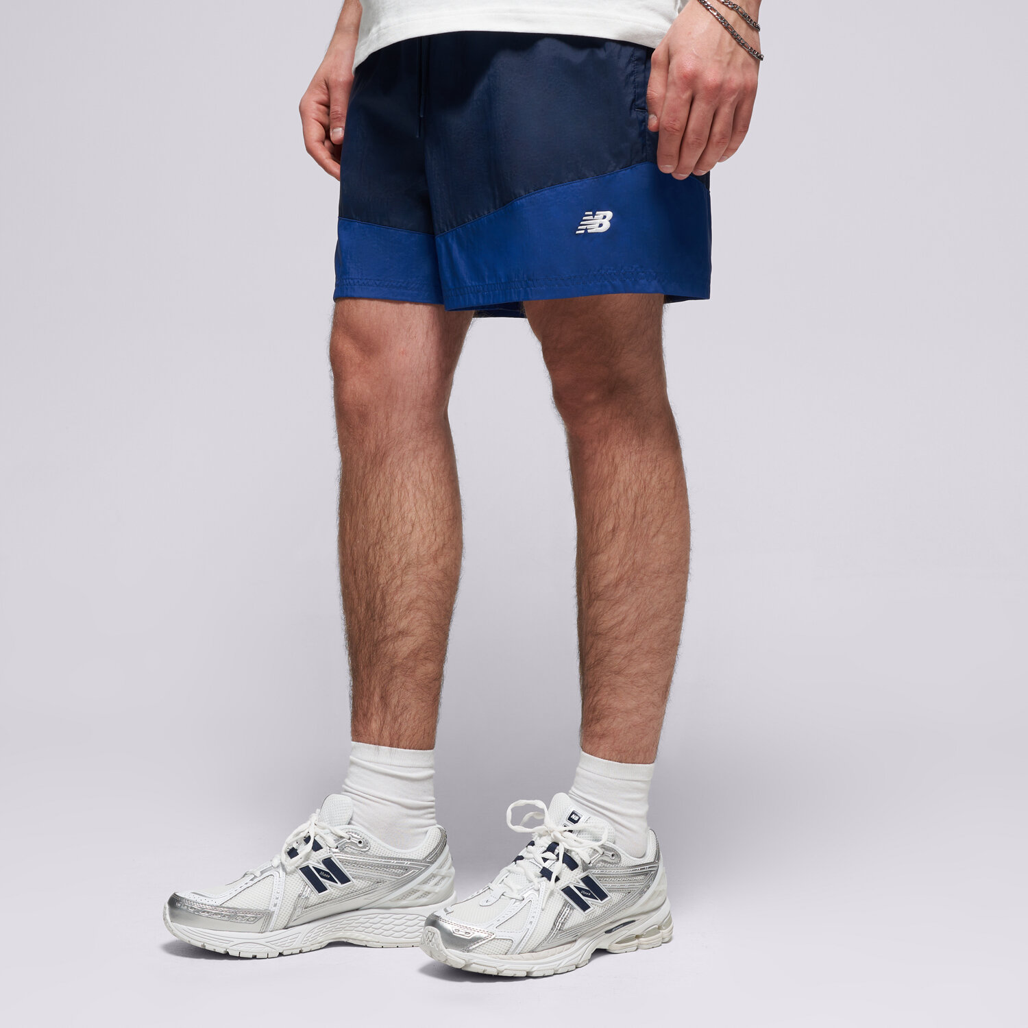 Femei pantaloni scurți NEW BALANCE PANTALONI SCURȚI SPORT LEGACY SHORT 5" MB6176MRNNY Bleumarin