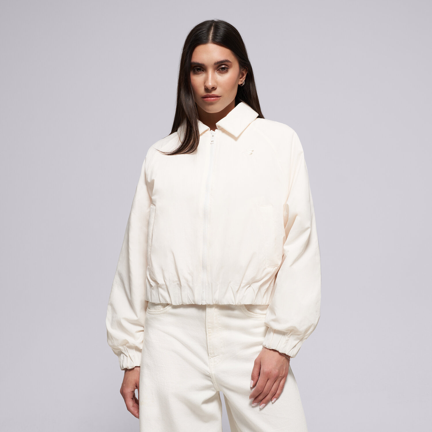 Femei jachetă NEW BALANCE JACHETĂ WOVEN BOMBER JACKET WJ61D8YXSST Bej