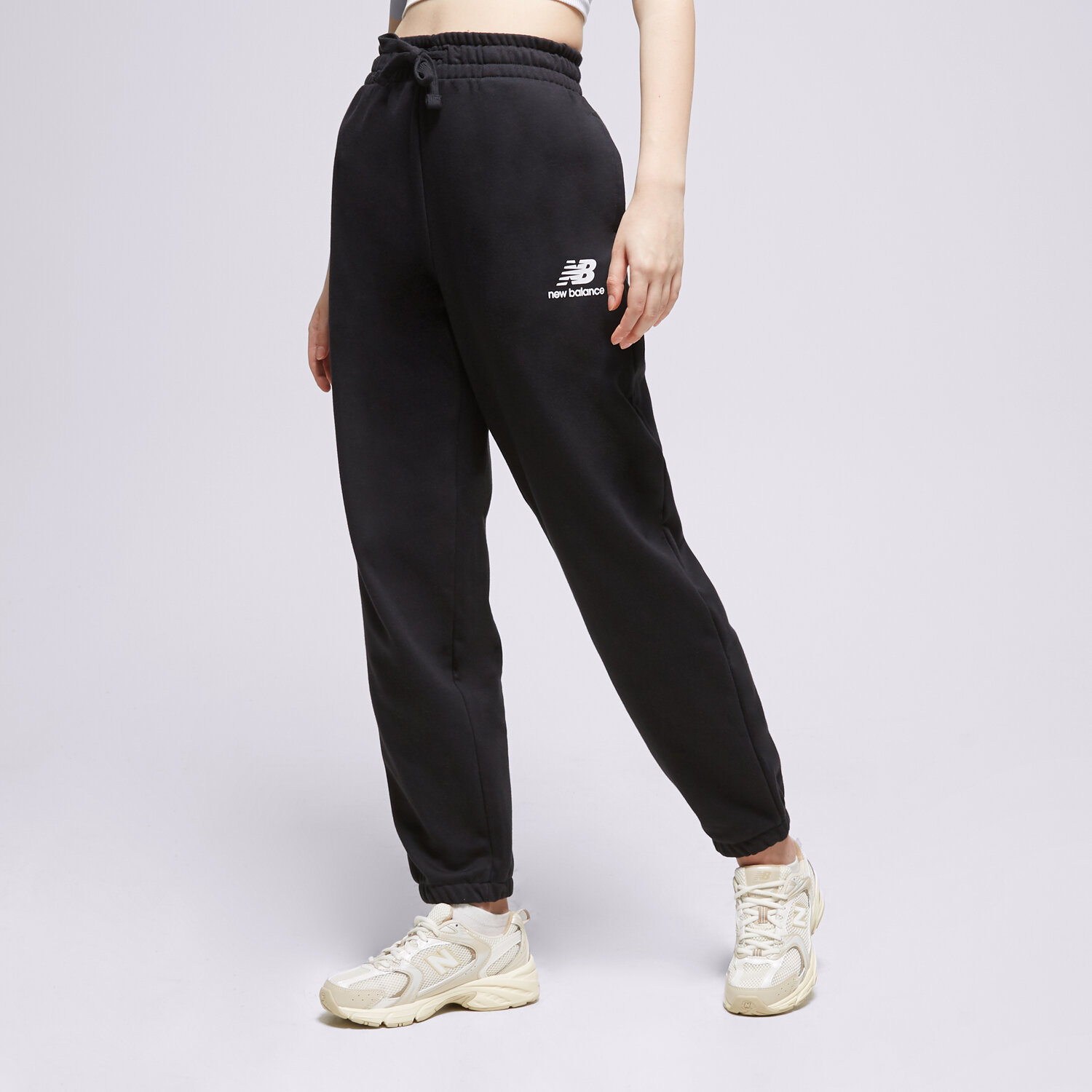 Femei pantaloni NEW BALANCE PANTALONI  NB ESSENTIALS STACKET WP31530BK Negru