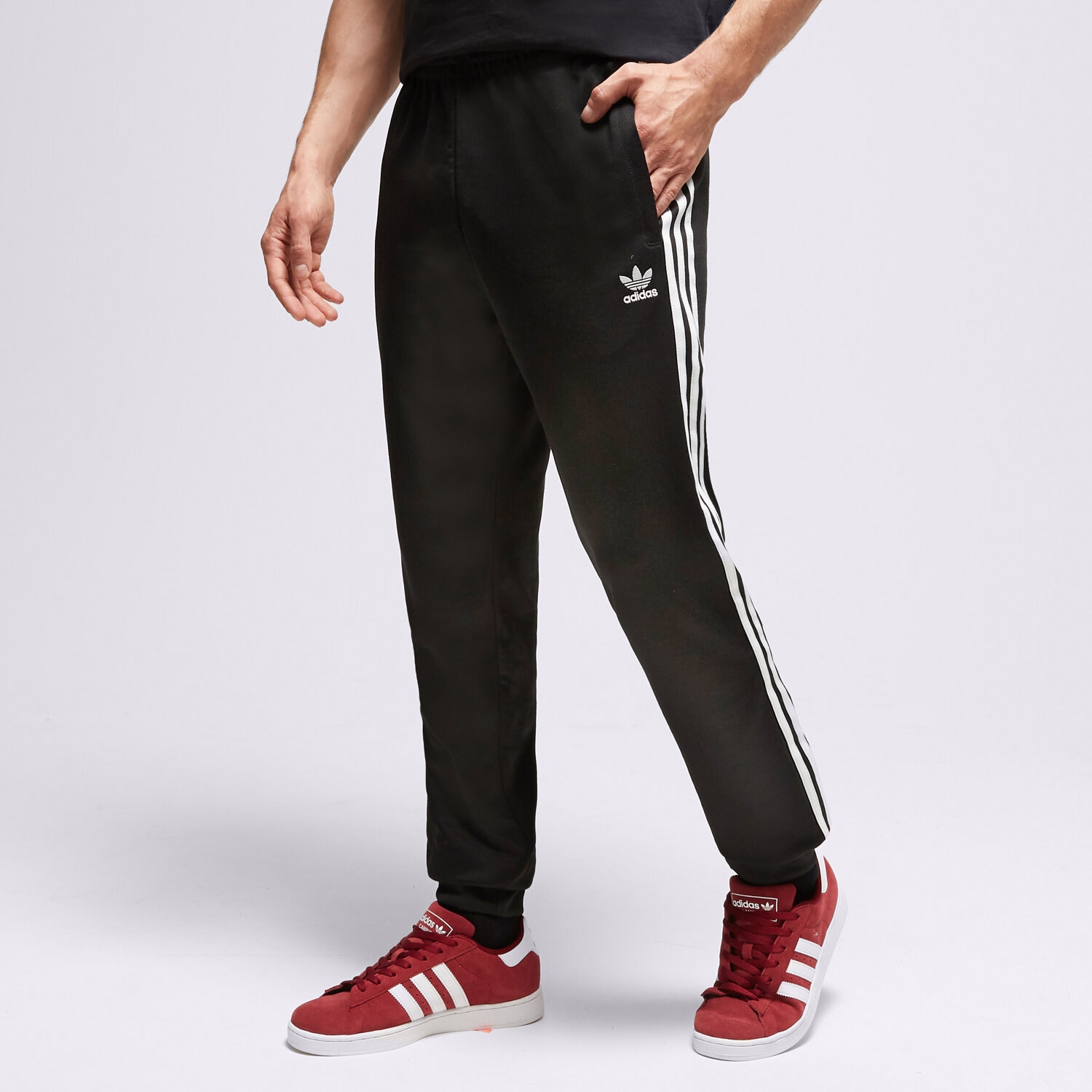 Bărbați pantaloni ADIDAS  PANTALONI  SST TRACK IL2488 Negru