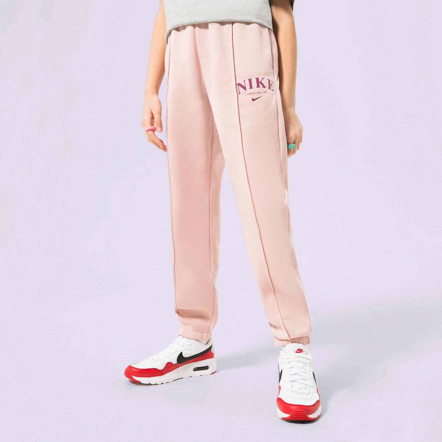Pantaloni pentru copii NIKE PANTALONI  G NSW TREND FLC CF PANT PRNT FD0886-601 Roz